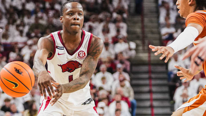 Arkansas Razorbacks guard Johnell Davis passes against the Texas Longhorns at Bud Walton Arena in Fayetteville, Ark.