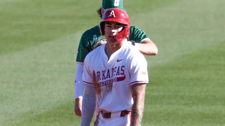 Arkansas Razorbacks shortstop Wehiwa Aloy on second base in first inning against the Charlotte 49ers at Baum-Walker Stadium in Fayetteville, Ark Arkansas Razorbacks shortstop Wehiwa Aloy on second base in first inning against the Charlotte 49ers at Baum-Walker Stadium in Fayetteville, Ark