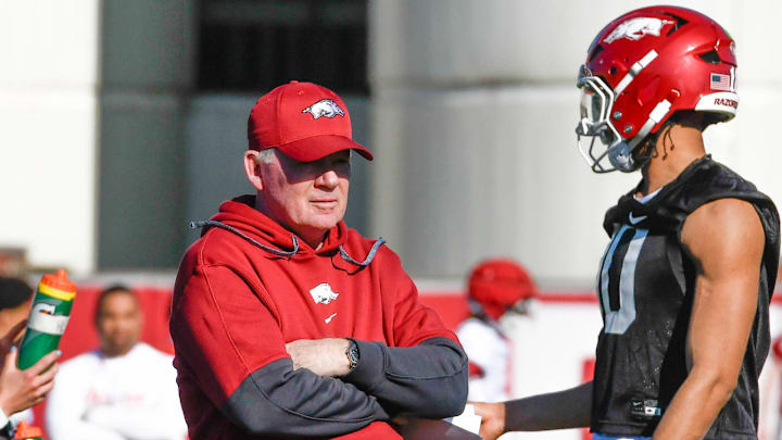 Arkansas Razorbacks offensive coordinator Bobby Petrino talks with quarterback Taylen Green at spring practice on outdoor practice fields in Fayetteville, Ark.