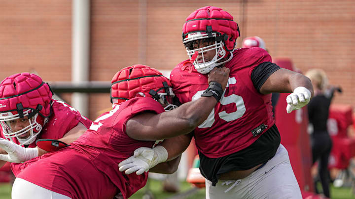 Arkansas Razorbacks' massive defensive lineman Ian Geffrard during spring practice drills on the outdoor fields in Fayetteville, Ark. Arkansas Razorbacks' massive defensive lineman Ian Geffrard during spring practice drills on the outdoor fields in Fayetteville, Ark.