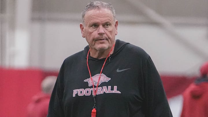 Arkansas Razorbacks coach Sam Pittman watching spring practice drills indoors in Fayetteville, Ark.