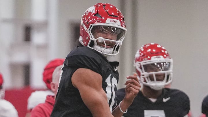 Arkansas Razorbacks quarterback Taylen Green throwing a pass during practices indoors in Fayetteville, Ark.