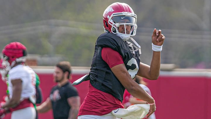 Arkansas Razorbacks quarterback Madden Imaleava follows through on a pass in spring practice drills on the outdoor fields in Fayetteville, Ark. Arkansas Razorbacks quarterback Madden Imaleava follows through on a pass in spring practice drills on the outdoor fields in Fayetteville, Ark.