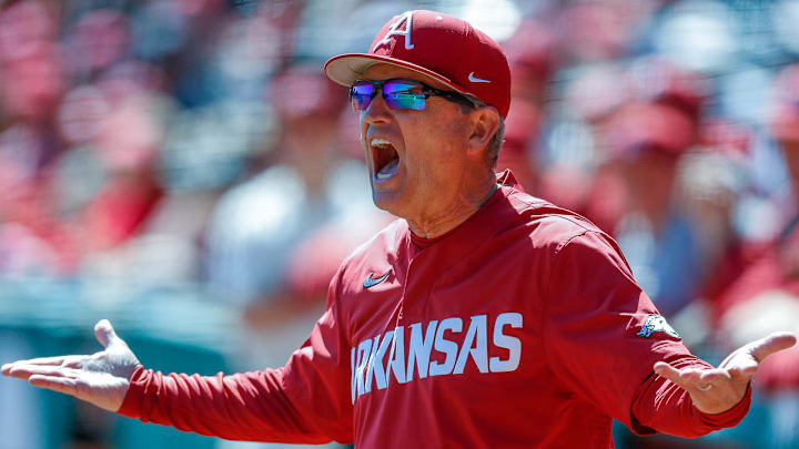 Arkansas Razorbacks coach Dave Van Horn reacting to a call in the field in a game.
