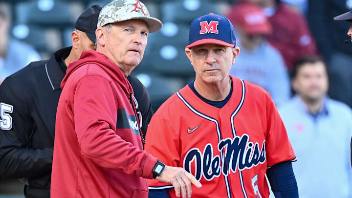 Arkansas Razorbacks coach Dave Van Horn and Ole Miss Rebels coach Mike Bianco meeting at home plate before a game in 2024 at Baum-Walker Stadium in Fayetteville, Ark. Arkansas Razorbacks coach Dave Van Horn and Ole Miss Rebels coach Mike Bianco meeting at home plate before a game in 2024 at Baum-Walker Stadium in Fayetteville, Ark.