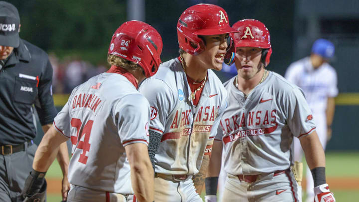 Arkansas Razorbacks Charles Davalan and Wehiwa Aloy celebrate after a homer against the Creighton Bluejays in the NCAA Regional in Fayetteville, Ark. Arkansas Razorbacks Charles Davalan and Wehiwa Aloy celebrate after a homer against the Creighton Bluejays in the NCAA Regional in Fayetteville, Ark.