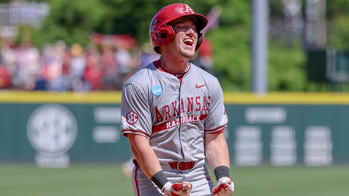 Arkansas Razorbacks' Logan Maxwell celebrates coming home after a grand slam homer against the Tennessee Volunteers in Fayetteville, Ark. Arkansas Razorbacks' Logan Maxwell celebrates coming home after a grand slam homer against the Tennessee Volunteers in Fayetteville, Ark.