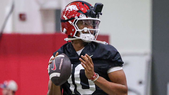 Arkansas Razorbacks quarterback Taylen Green with his VR camera at the team's first practice in Fayetteville, Ark.