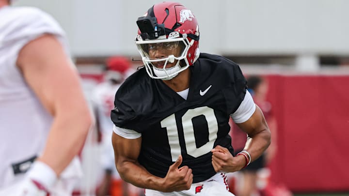 Arkansas Razorbacks quarterback Taylen Green with his VR camera at the team's first practice in Fayetteville, Ark.