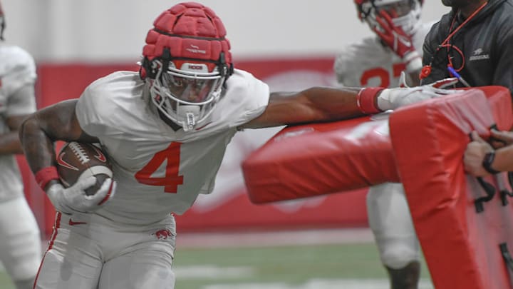 Arkansas Razorbacks running back Mike Washington runs during preseason practice at the indoor practice center in Fayetteville, Ark.