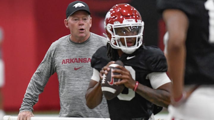 Arkansas Razorbacks offensive coordinator Bobby Petrino watches quarterback Trever Jackson during preseason practices at the indoor center in Fayetteville, Ark.