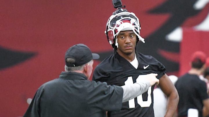Arkansas Razorbacks quarterback Taylen Green listening to offensive coordinator Bobby Petrino in preseason practice at the indoor center in Fayetteville, Ark. Arkansas Razorbacks quarterback Taylen Green listening to offensive coordinator Bobby Petrino in preseason practice at the indoor center in Fayetteville, Ark.