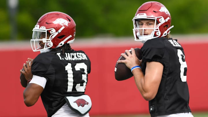 Arkansas Razorbacks quarterbacks Trever Jackson (13) and Grayson Wilson (8) during preseason practices in Fayetteville, Ark.