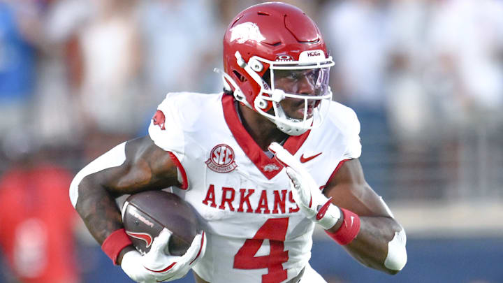 Arkansas Razorbacks running back Mike Washington breaking free against the Ole Miss Rebels in a game at Vaught-Hemingway Stadium in Oxford, Miss.
