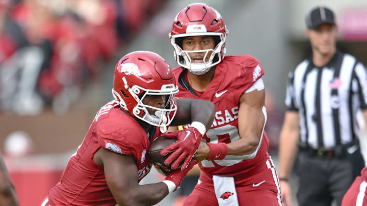 Arkansas Razorbacks quarterback Taylen Green and running back Braylen Russell on the mesh during a play against the Texas A&M Aggies at Razorback Stadium in Fayetteville, Ark.