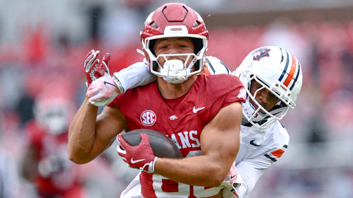 Arkansas Razorbacks tight end Rohan Jones tries to break away from Auburn Tigers defender in game at Razorback Stadium in Fayetteville, Ark.