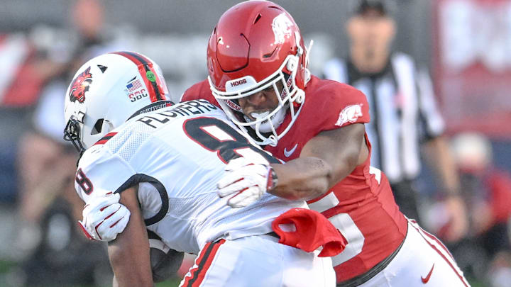 Arkansas Razorbacks linebacker Tavian Wallace makes a stop in a game against the Arkansas State Red Wolves at War Memorial Stadium in Little Rock, Ark.