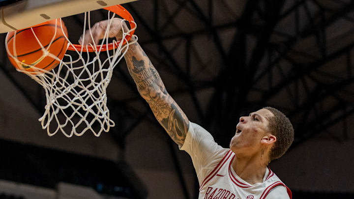 Arkansas Razorbacks forward Trevon Brazile dunking against the Texas Tech Red Raiders in a game at American Airlines Center in Dallas.