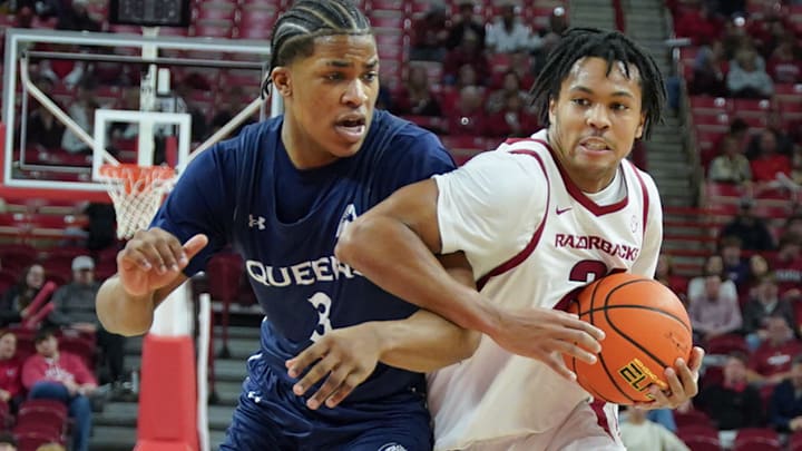 Arkansas Razorbacks guard DJ Wagner drives against the Queens Royals in a game at Bud Walton Arena in Fayetteville, Ark.