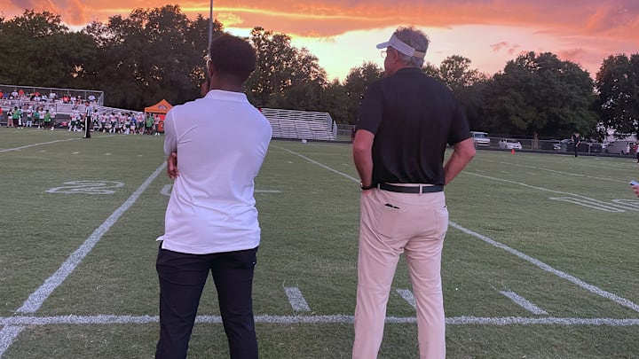 University of Central Florida head football coach Gus Malzahn watches from the sideline as UCF commit Taevion Swift and his Kissimmee Osceola Kowboys take on Jones High School. Swift impressed his head coach with a 31-yard TD run and added a second touchdown later.