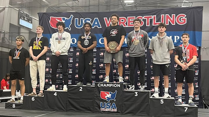 Indiana wrestler Xavier Smith stands atop the podium as the 175-pound champion at USA Wrestling's Folkstyle Nationals in Iowa.
