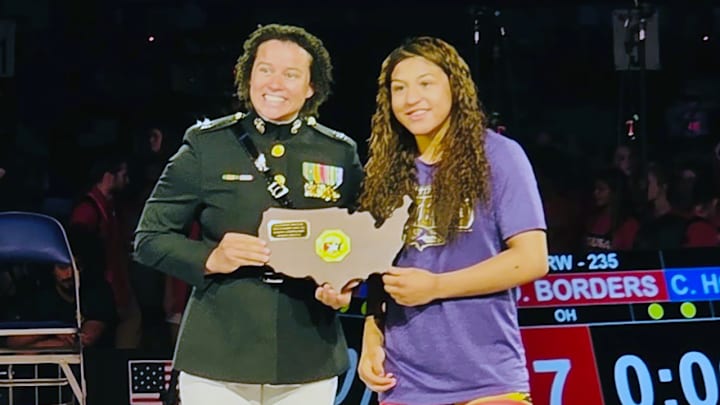 Taina Fernandez receives her Outstanding Wrestler award for her title in the 16U Nationals. She also won a Junior Nationals crown. Taina Fernandez receives her Outstanding Wrestler award for her title in the 16U Nationals. She also won a Junior Nationals crown.