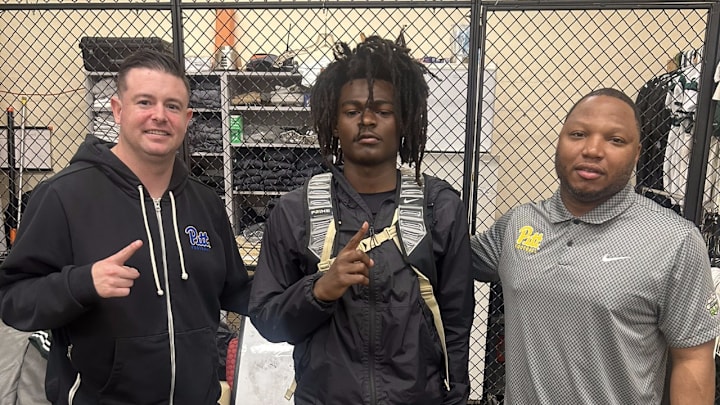 Pitt Football Offensive Coordinator Kade Bell and wide receivers coach JJ Laster with 2026 3-Star WR Santana Carlos 