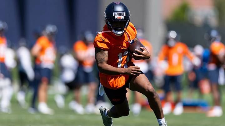Denver Broncos wide receiver Jaylen Waddle catches a pass during OTA practice at Broncos Park Powered by CommonSpirit.