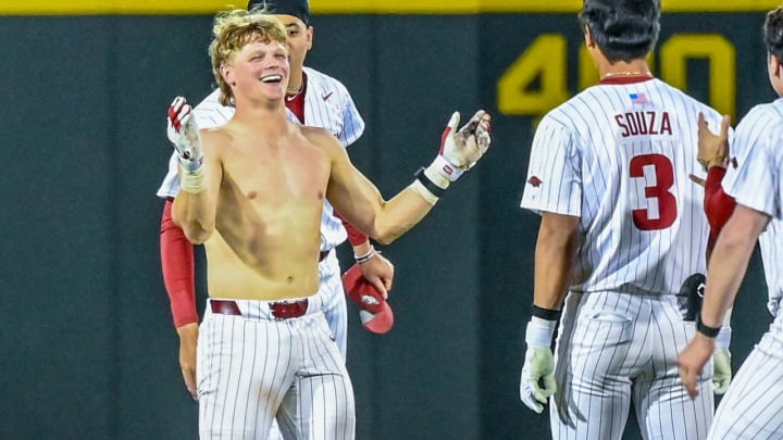 Arkansas Razorbacks' Hudson White after teammates ripped off his shirt celebrating after delivering a game-winning hit in the 10th inning against the LSU Tigers on Friday night at Baum-Walker Stadium in Fayetteville, Ark.