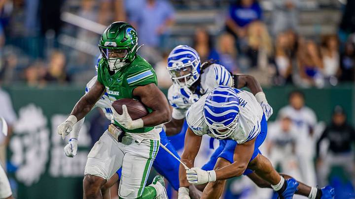 RB Johnnie Daniels loses his undershirt on his way to a TD RB Johnnie Daniels loses his undershirt on his way to a TD