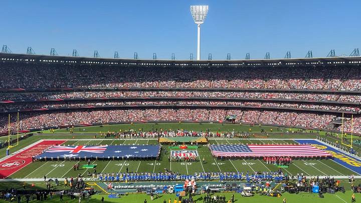 A general overall view of Australia and United States flags on the field during the playing of the national anthem at the 2026 NFL Melbourne Game at Melbourne Cricket Ground.