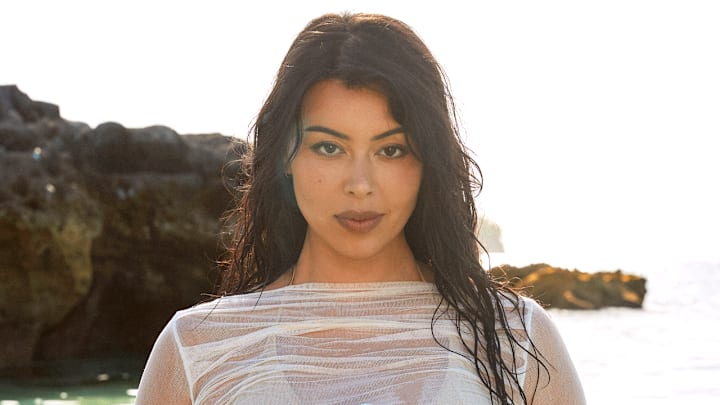 Lauren Chan was photographed by Ben Watts in Bermuda. Swimsuit by It’s Now Cool. Shirt by Enza Costa.