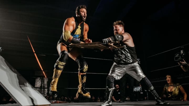 Paul Walter Hauser drilling Matt Cardona with a steel chair Paul Walter Hauser drilling Matt Cardona with a steel chair