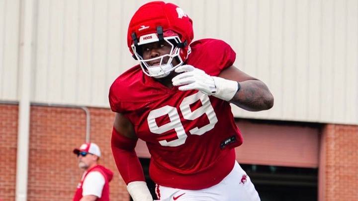 Arkansas Razorbacks defensive lineman Danny Beale goes through drills in spring practice.