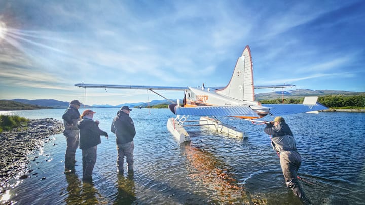 Guide Luke Valentino helping with the plane's takeoff. 