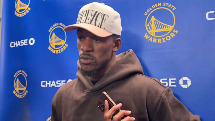 Warriors star Jimmy Butler reacts to his team's loss to the Rockets on Wednesday night.