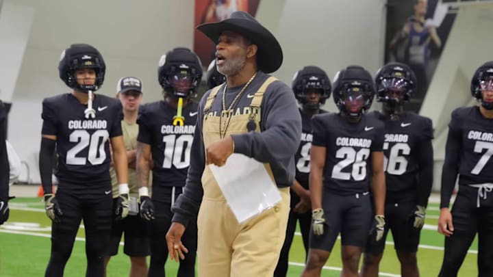 Colorado coach Deion Sanders addresses the team during Monday’s practice following news of quarterback Dominiq Ponder’s death.