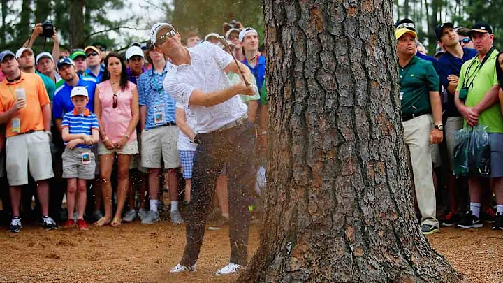 Justin Rose in the trees on the 7th hole in 2015.