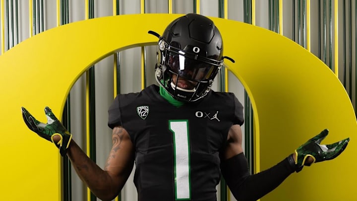 Oregon commit Dakorien Moore wears a black Ducks uniform during a visit. Oregon commit Dakorien Moore wears a black Ducks uniform during a visit.