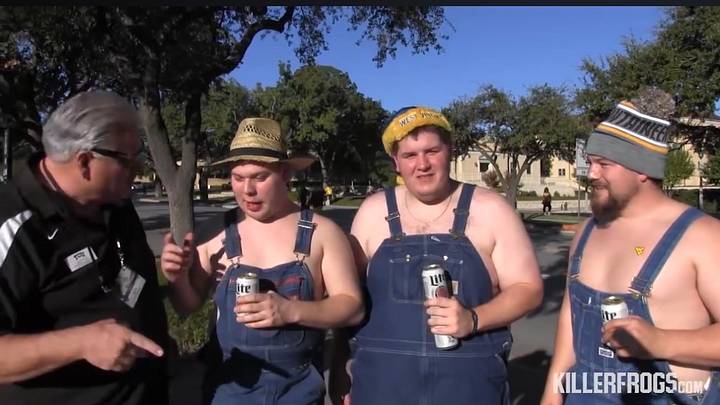 KillerFrogs’ Scott Nix interviews three West Virginia fans sporting overalls before the Mountaineers’ 2015 game at TCU in Fort Worth. | Credit: KillerFrogs.com KillerFrogs’ Scott Nix interviews three West Virginia fans sporting overalls before the Mountaineers’ 2015 game at TCU in Fort Worth. | Credit: KillerFrogs.com