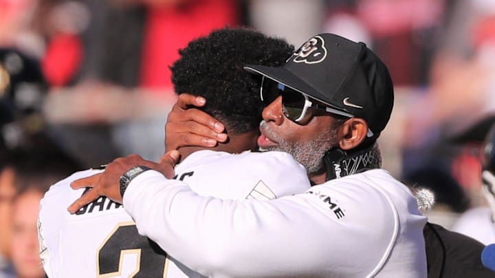 Colorado football coach Deion Sanders hugs his son, Shedeur Sanders, before facing Texas Tech in a Big 12 football game Saturday, Nov. 9, 2024, at Jones AT&T Stadium. Colorado football coach Deion Sanders hugs his son, Shedeur Sanders, before facing Texas Tech in a Big 12 football game Saturday, Nov. 9, 2024, at Jones AT&T Stadium.