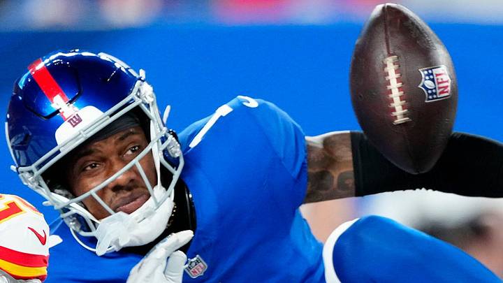 New York Giants wide receiver Malik Nabers looks at a ball
