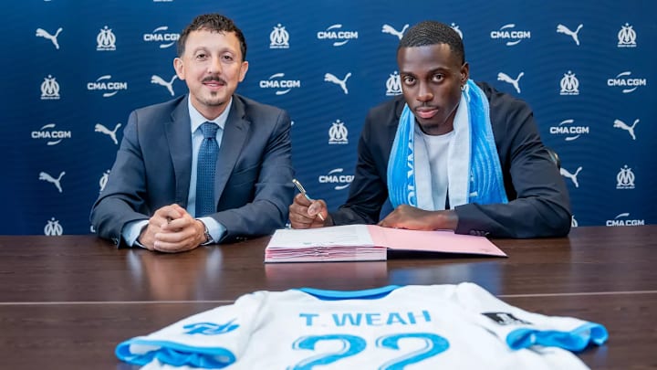 Tim Weah put pen to paper with Olympique Marseille.