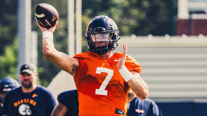 Virginia Cavaliers quarterback Beau Pribula launches the football at fall camp practice.