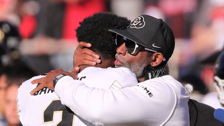 Colorado football coach Deion Sanders hugs his son, Shedeur Sanders, before facing Texas Tech. Colorado football coach Deion Sanders hugs his son, Shedeur Sanders, before facing Texas Tech.