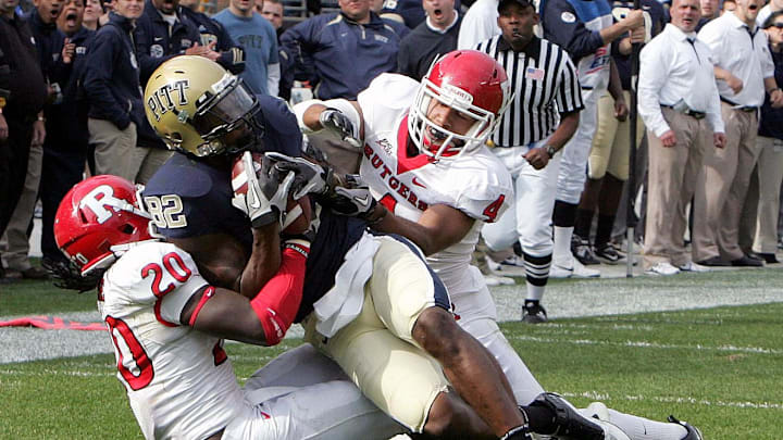 October 23, 2010; Pittsburgh,PA, USA; Pittsburgh Panthers receiver Jon Baldwin (82) catches a pass between Rutgers Scarlet Knights defenders Khaseem Green (20) and David Rowe (4) during the third quarter at Heinz Field. Pittsburgh won 41-21. Mandatory Credit: Charles LeClaire-USPRESSWIRE