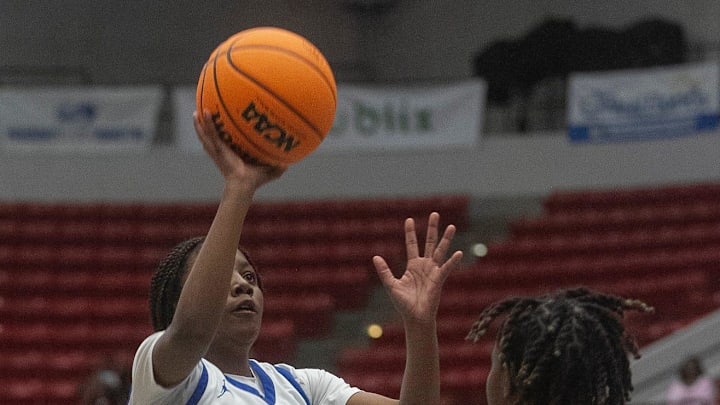 Wildwood  s Trinidy Harris (10) goes up for basket against Hawthorne during their FHSAA Girls 1A Championship Basketball game at The RP Funding Center in Lakeland Wednesday. February 24, 2023. (MICHAEL WILSON)