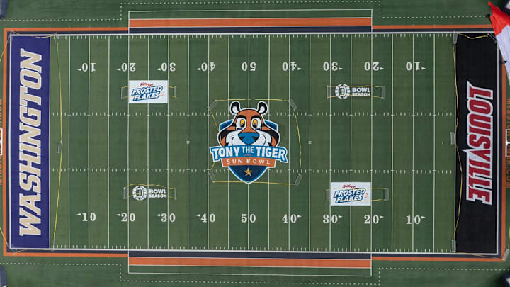 The Sun Bowl Stadium is painted with university names - Washington and Louisville - and sponsor logos for the Tony the Tiger Sun Bowl on Tuesday, Dec. 31, in El Paso, Texas. The nationally-televised game is a marquee event showcasing the Sun City's culture, heritage and ties to Fort Bliss, an important U.S. Army post.