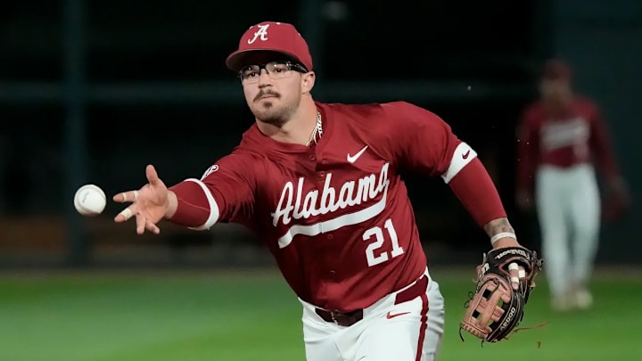 Alabama second baseman, Brennan Norton (21), flips a ball under hand to record an out versus the Tennessee Volunteers on Thursday, March 20th, 2025: Mandatory Credit: Gary Cosby Jr.-Tuscaloosa News
