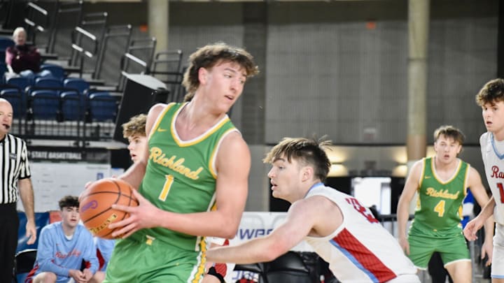 Landen Northrop (left) and Richland won its first state title in over four decades after beating Gonzaga prep in the Class 4A boys basketball final.